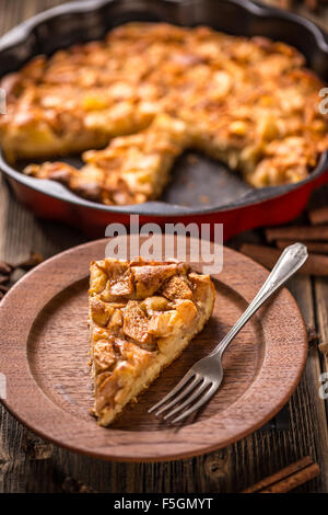 Apple pie slice on wooden plate Stock Photo