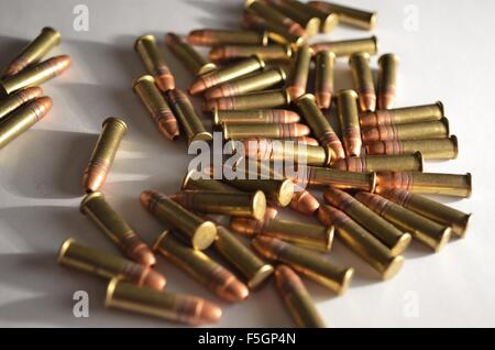 bullets in a pile on white background Stock Photo