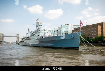 HMS Belfast on the Thames in London. One of the first ships to open fire on D-Day 1945. Now a major tourist attraction. Stock Photo