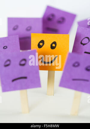 conceptual image for a be different or be happy concept using sticky notes Stock Photo
