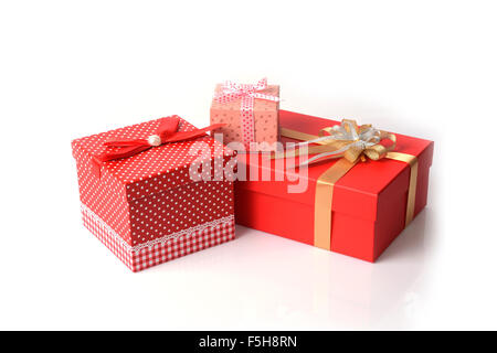 Three gift boxes, various size and design, on white background. Stock Photo