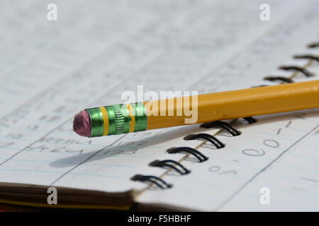 A Pencil on an Open Notebook Stock Photo