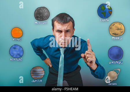 businessman raised his index finger up angry planets of the sola Stock Photo