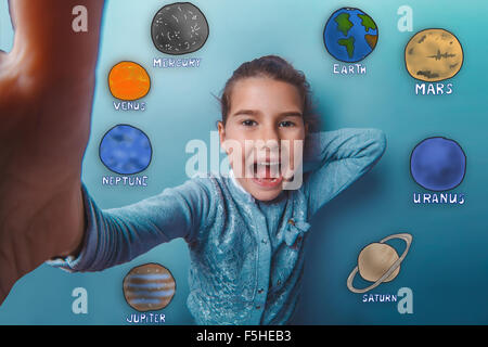 girl is photographed close-up of a happy laughing planets of the Stock Photo