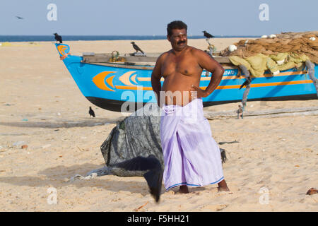 Traditional fisherman in canoe in Batticaloa, Sri Lanka Stock Photo