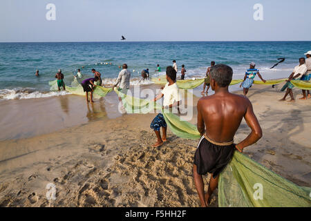 Traditional fisherman in canoe in Batticaloa, Sri Lanka Stock Photo