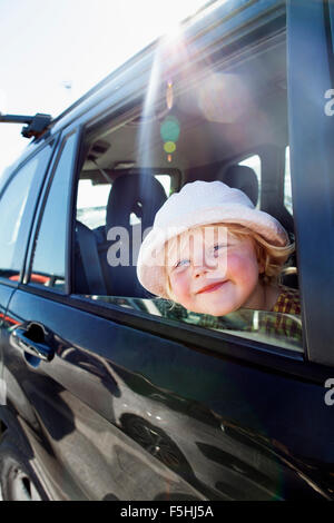 Sweden, Gotland, Visby, Portrait of girl sitting in car