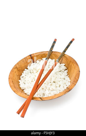 Bamboo bowl with rice and chopsticks isolated on white Stock Photo