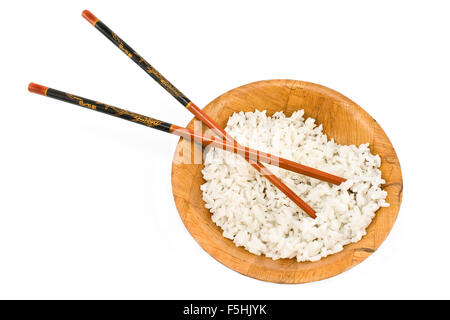 Bamboo bowl with rice and chopsticks isolated on white Stock Photo