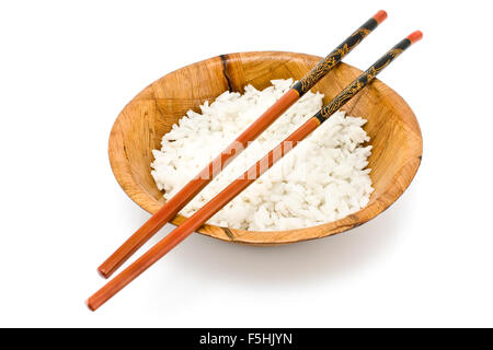 Bamboo bowl with  rice and chopsticks isolated on white Stock Photo