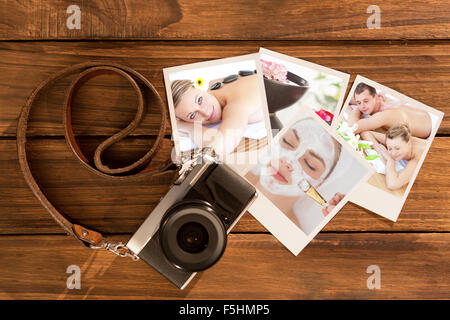 Composite image of loving young couple enjoying a back massage Stock Photo