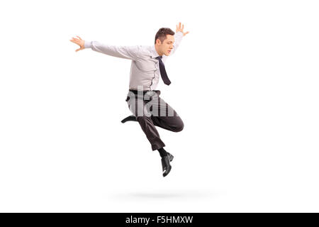 Studio shot of a young businessman jumping in the air isolated on white background Stock Photo