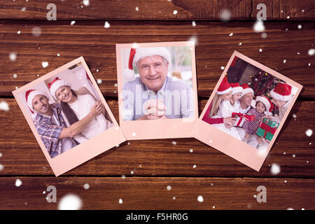 Composite image of instant photos on wooden floor Stock Photo