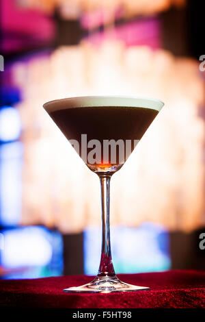 espresso coffee Martini cocktail drink in trendy bar interior