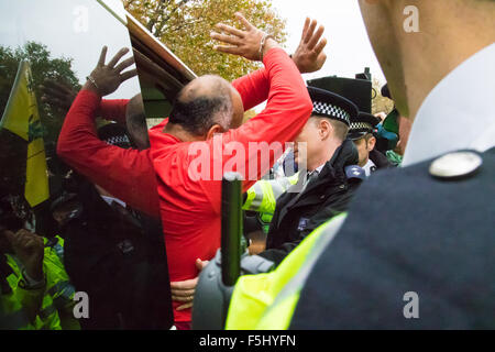 Whitehall, London, November 5th 2015. Pro Sisi demonstrators and counter protesters from UK Egyptian and human rights groups shout each other down outside Downing Street ahead of Egypt’s President Abdel Fatah al-Sisi visiting Prime Minister David Cameron at No. 10. PICTURED: A pro-Morsi supporter is arrested by police. Credit:  Paul Davey/Alamy Live News Stock Photo