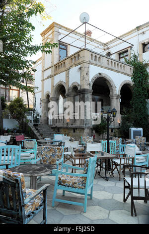 Exterior view of  empty chairs and tables outside a club cafe restaurant at mid day in Kyrenia Girne North Cyprus   KATHY DEWITT Stock Photo