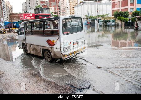 Alexandria, Alexandria, Egypt. 5th Nov, 2015. An Egyptian man drives in a flooded road following heavy rain storm, in Alexandria, Egypt, November 5, 2015. Eleven people were killed in floods in Beheira province north of Cairo, a security source said, and authorities evacuated 100 people from a village in the province as Egypt suffers from a second round of stormy weather in less than a month Credit:  Amr Sayed/APA Images/ZUMA Wire/Alamy Live News Stock Photo