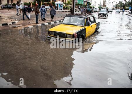 Alexandria, Alexandria, Egypt. 5th Nov, 2015. An Egyptian man drives in a flooded road following heavy rain storm, in Alexandria, Egypt, November 5, 2015. Eleven people were killed in floods in Beheira province north of Cairo, a security source said, and authorities evacuated 100 people from a village in the province as Egypt suffers from a second round of stormy weather in less than a month Credit:  Amr Sayed/APA Images/ZUMA Wire/Alamy Live News Stock Photo