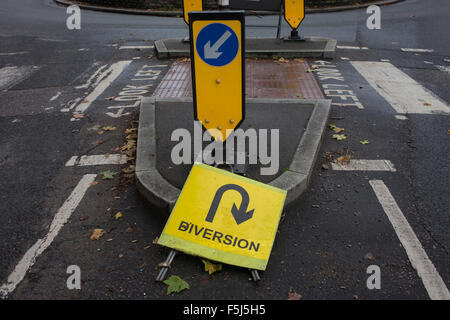 Confusing and contradiction of a diversion sign near a roundabout in East Dulwich, south London. Stock Photo