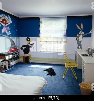 Cartoon characters painted on walls of a child's seventies bedroom Stock Photo