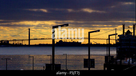 The Ambassador bridge over the Detroit River at sunset viewed from downtown Detroit, USA Stock Photo