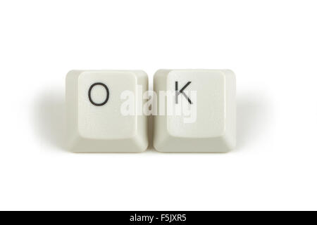 ok text from scattered keyboard keys isolated on white background Stock Photo