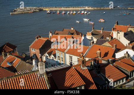 Red Rooftops and Harbour, Staithes fishing and holiday village, North Yorkshire. Associated with James Cook Stock Photo