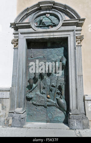 Bronze sculpture of bishops by Marko Mitic on a door on the Cathedral of St. Nicholas in Ljubljana in Slovenia Stock Photo