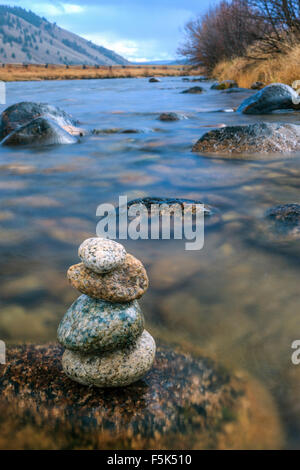 Closeup of stacked rocks in river. Stock Photo