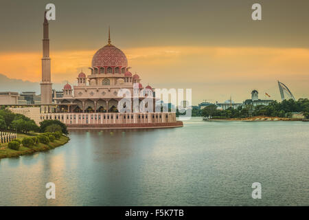 Sunset over Putrajaya Mosque and Panorama of Kuala Lumpur, Malaysia. Stock Photo