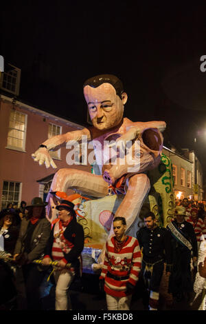 Lewes East Sussex. UK.  5th November, 2015. A tableau of David Cameron and a pig is paraded through the streets of Lewes on their annual bonfire night celebrations. Credit:  Ed Brown/Alamy Live News Stock Photo