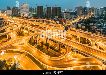 Chengdu city, Sichuan Province, China - Oct 28, 2015: Car traffic on Yingmenkou interchange crossing roads at night. Stock Photo