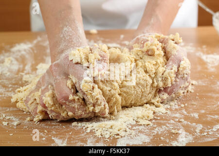 A baker kneading dough. Making Pastry Dough for Hungarian Cake. Series. Stock Photo
