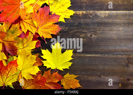 autumn leaves on the wooden rustic table with copy space for background Stock Photo