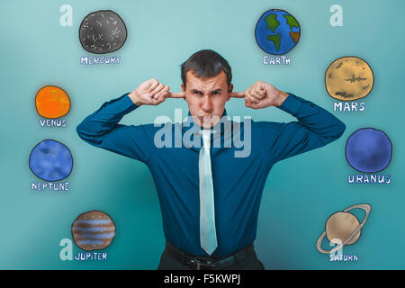 man winced and plugged ears forefingers unwillingness to listen Stock Photo