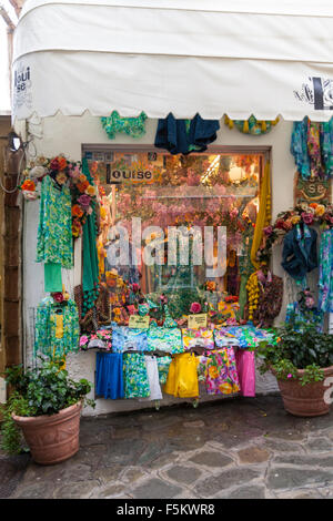 Colorful shop window of Louise Moda,selling clothing and bright handicrafts in Positano, Amalfi Coast, Italy Stock Photo