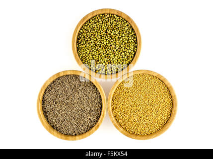 Aerial of bowls of cumin seasoning, pickling mustard, cilantro pods Stock Photo