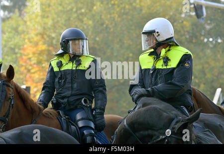 Police on a horseback are having an eye for security during a demonstration Stock Photo