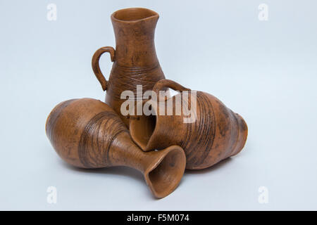 Several brown ceramic jug on a gray background Stock Photo