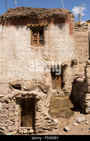 India, Himachal Pradesh, Spiti Valley, Kibber, small wooden door to traditionally built stone house Stock Photo