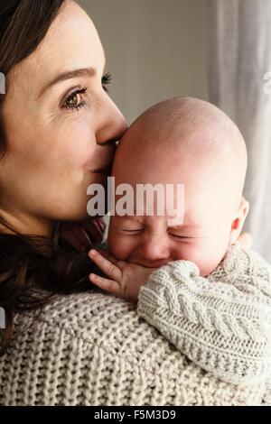 Mother soothing crying baby boy Stock Photo