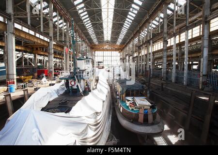 Two boats in dry dock Stock Photo