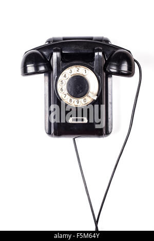 Old black obsolete vintage retro phone isolated on white background Stock Photo