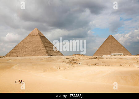 Egypt, Cairo: the Pyramid of Khafre (or Chephren) and the Great Pyramid of Giza (also known as the Pyramid of Khufu or the Pyramid of Cheops) Stock Photo