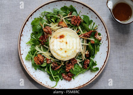 Grilled goat cheese, walnut, apple and rocket salad Stock Photo