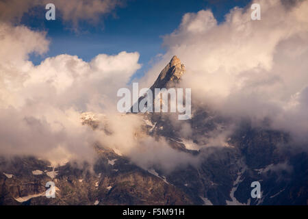 India, Himachal Pradesh, Reckong Peo, Kalpa, Shivling Peak, birthplace of Shiva emerging from clouds Stock Photo