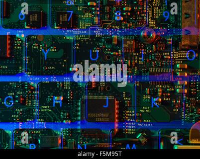Double exposure of the inside and out of a laptop computer showing the electronic components under the keyboard Stock Photo