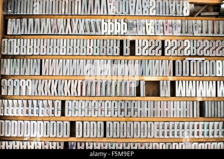 Shelves of silver letterpress letters in print workshop Stock Photo