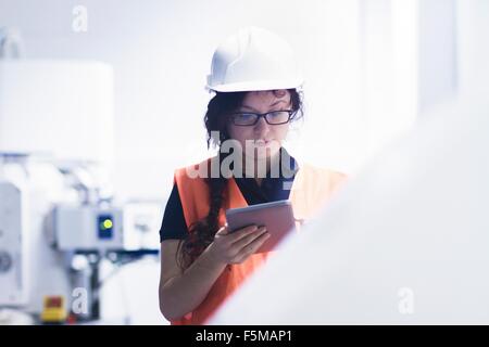 Technician working in factory Stock Photo