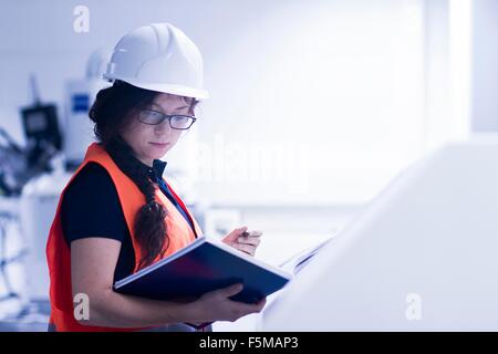 Technician working in factory Stock Photo